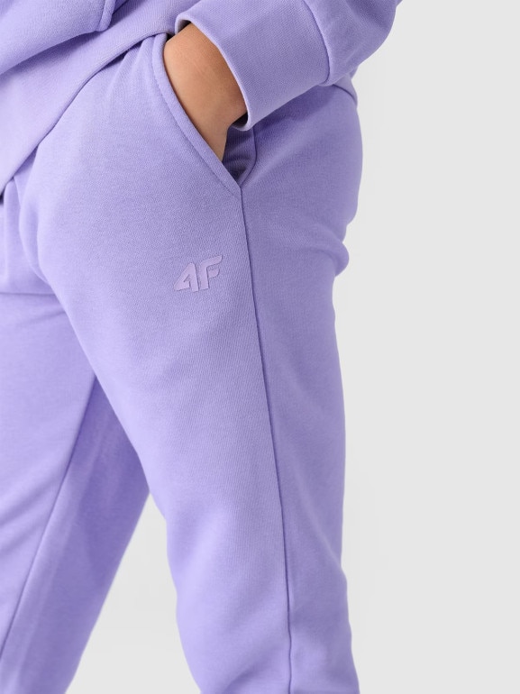 Dziewczęce spodnie dresowe joggery 4F 4FJWMM00TTROF0829-27M - fioletowe