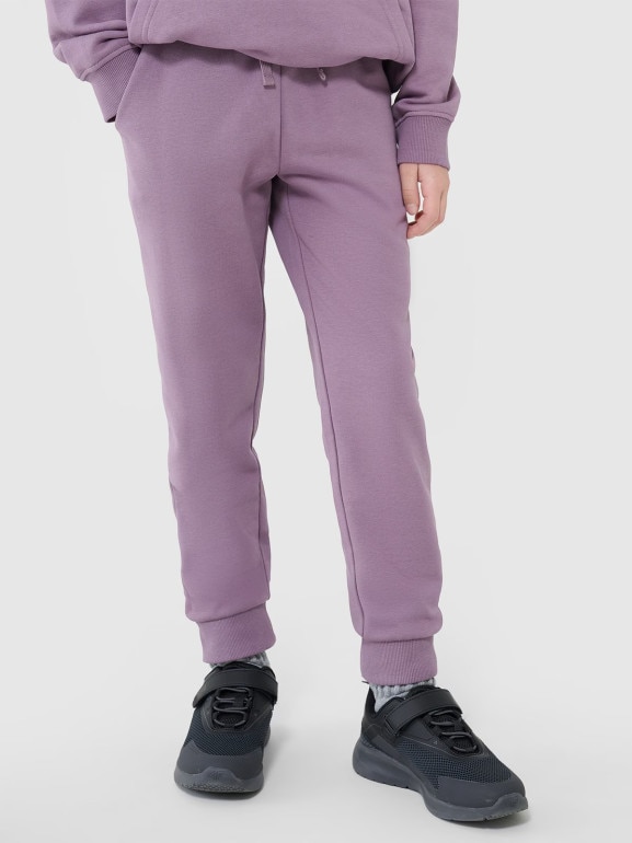 Dziewczęce spodnie dresowe joggery 4F 4FJWMM00TTROF0829-27M - fioletowe