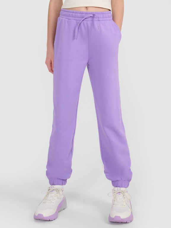 Dziewczęce spodnie dresowe joggery 4F 4FJWSS25TTROF1187 - fioletowe