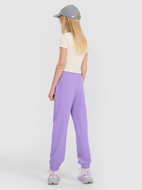 Dziewczęce spodnie dresowe joggery 4F 4FJWSS25TTROF1187 - fioletowe