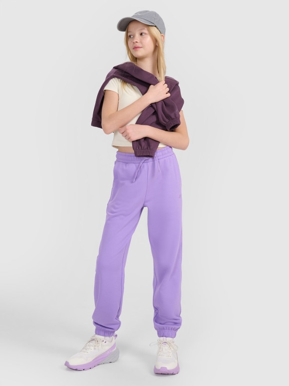 Dziewczęce spodnie dresowe joggery 4F 4FJWSS25TTROF1187 - fioletowe