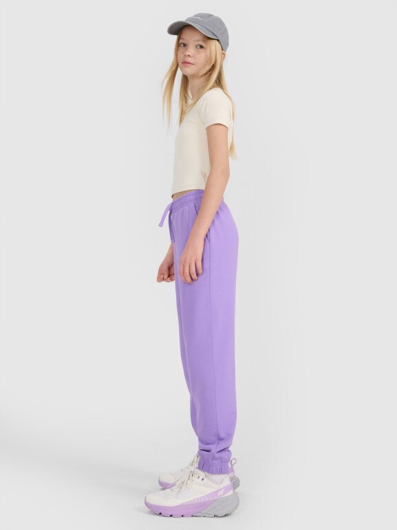 Dziewczęce spodnie dresowe joggery 4F 4FJWSS25TTROF1187 - fioletowe