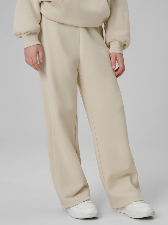 Dziewczęce spodnie dresowe 4F 4FJWSS26TTROF1656 - beżowe