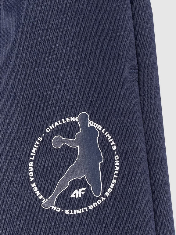 Chłopięce spodnie dresowe joggery 4F 4FJWAW25TTROM1258 - granatowe