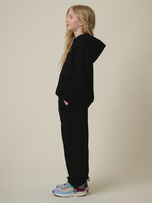 Dziewczęce spodnie dresowe 4F 4FJRSS26TTROF1869 - czarne