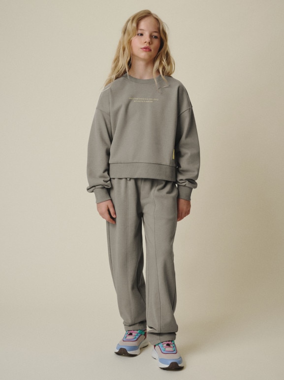 Dziewczęce spodnie dresowe 4F 4FJRSS26TTROF1871 - beżowe