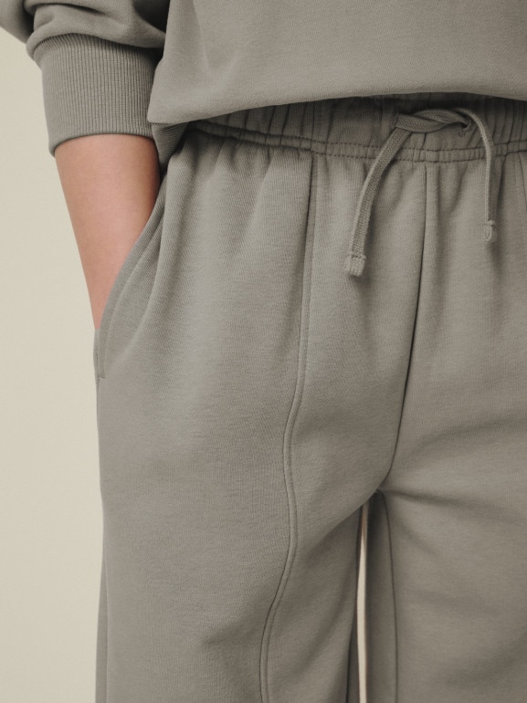 Dziewczęce spodnie dresowe 4F 4FJRSS26TTROF1871 - beżowe