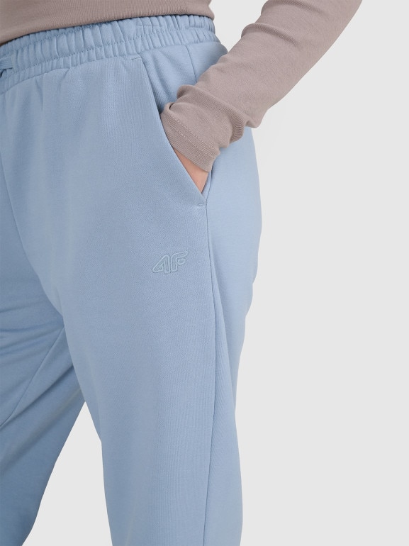 Dziewczęce spodnie dresowe joggery 4F 4FJRAW25TTROF1616 - niebieskie