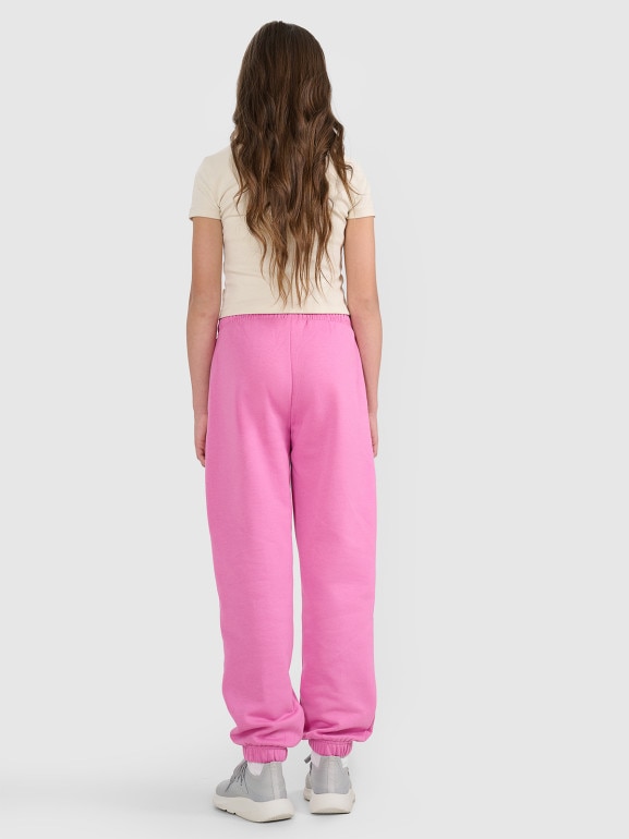 Dziewczęce spodnie dresowe joggery 4F 4FJRAW25TTROF1616 - różowe