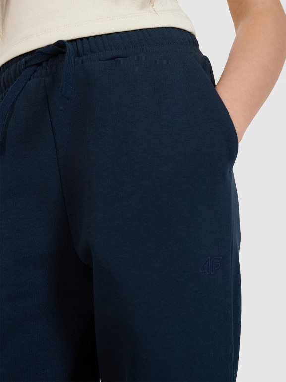 Dziewczęce spodnie dresowe joggery 4F 4FJWMM00TTROF1189 - granatowe