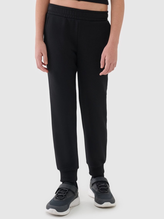 Dziewczęce spodnie dresowe joggery 4F 4FJWSS25TTROF1099 - czarne