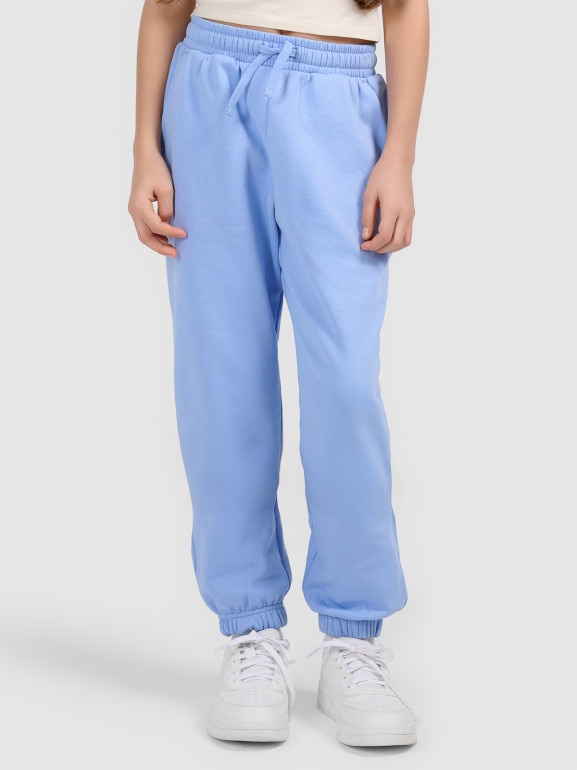 Dziewczęce spodnie dresowe joggery 4F 4FJWSS26TTROF1502 - niebieskie