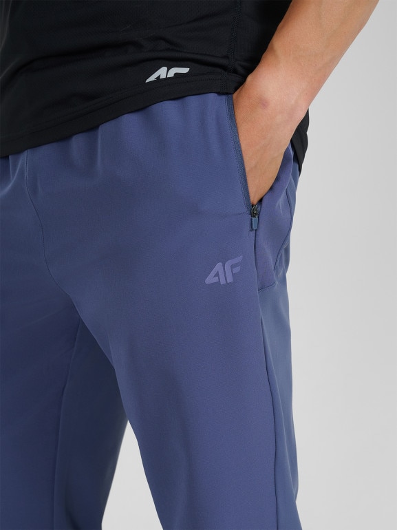 Męskie spodnie do biegania w terenie 4F 4FWAW25TFTRM0930 - niebieskie
