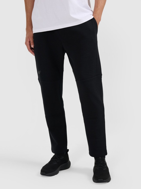 Męskie spodnie dresowe 4F 4FWAW25TTROM1193 - czarne
