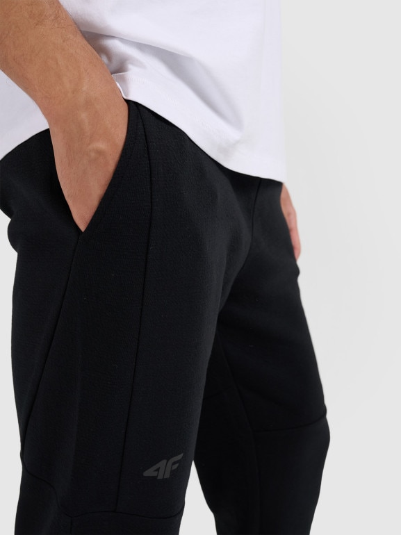Męskie spodnie dresowe 4F 4FWAW25TTROM1193 - czarne