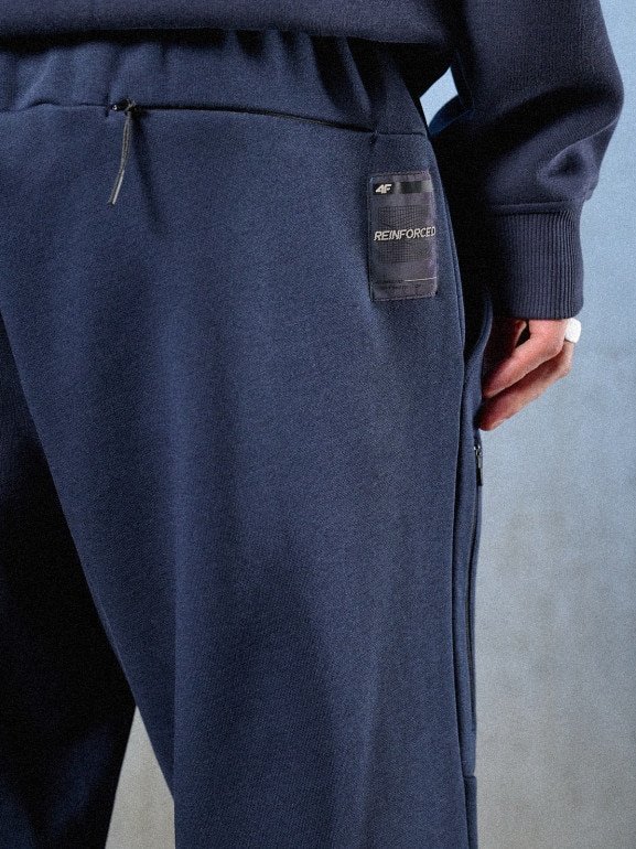 Męskie spodnie dresowe joggery 4F 4FRSS26TTROM1861 - granatowe