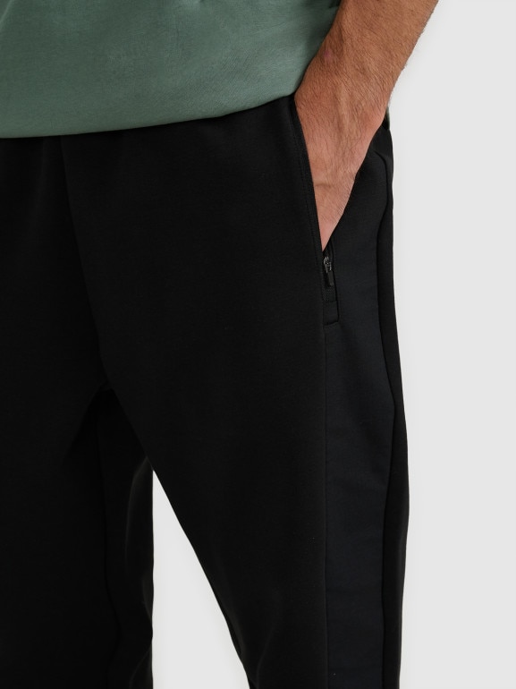 Męskie spodnie dresowe joggery 4F 4FWAW25TTROM1252 - czarne