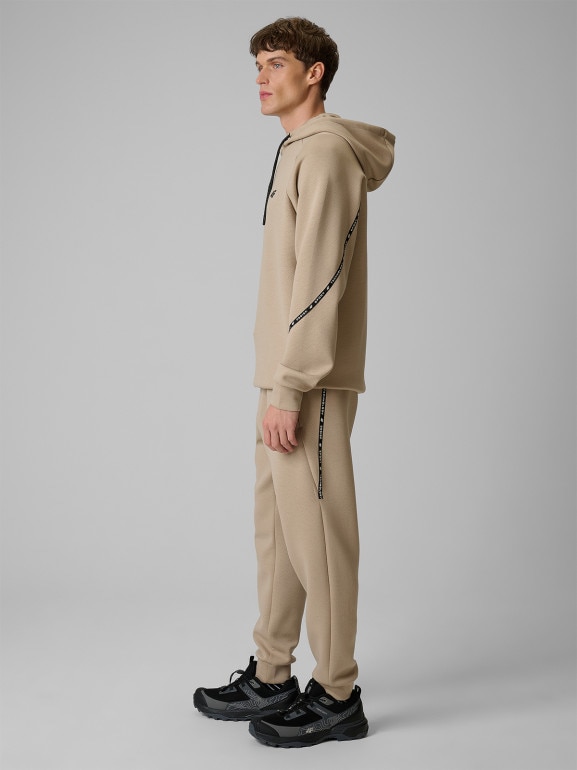 Męskie spodnie dresowe joggery 4F 4FWSS26TTROM1443 - beżowe