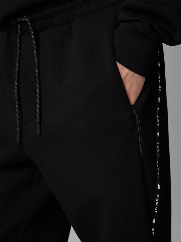 Męskie spodnie dresowe joggery 4F 4FWSS26TTROM1443 - czarne