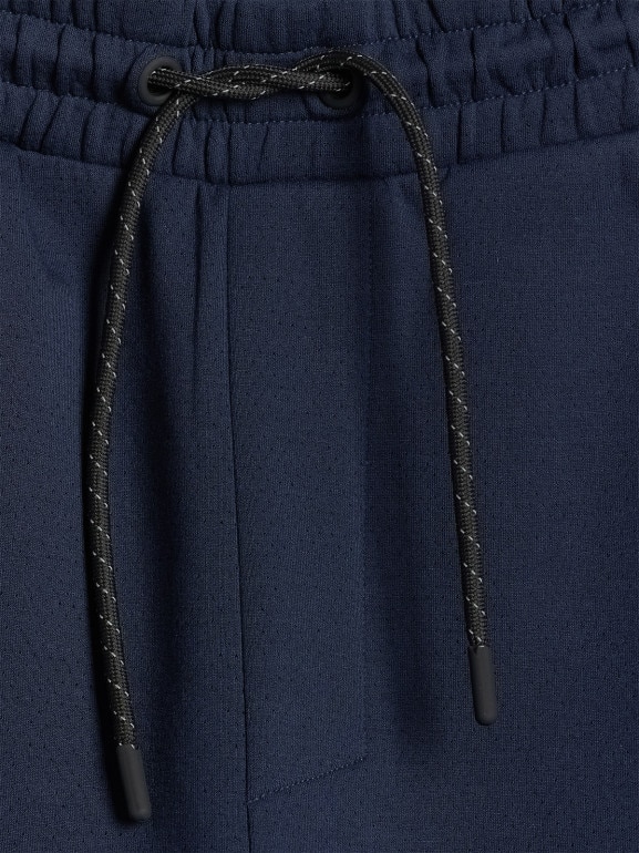 Męskie spodnie dresowe joggery 4F 4FWSS26TTROM1443 - granatowe