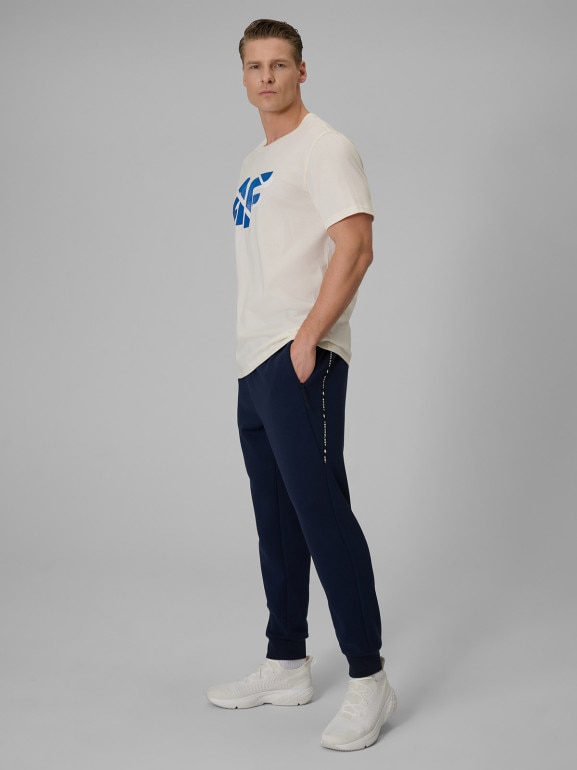 Męskie spodnie dresowe joggery 4F 4FWSS26TTROM1443 - granatowe