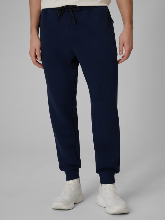 Męskie spodnie dresowe joggery 4F 4FWSS26TTROM1443 - granatowe