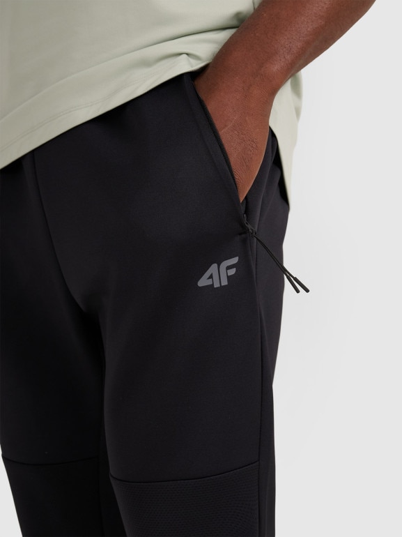 Męskie spodnie treningowe 4F 4FWAW25TFTRM0888 - czarne