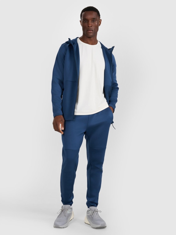 Męskie spodnie treningowe 4F 4FWAW25TFTRM0888 - granatowe