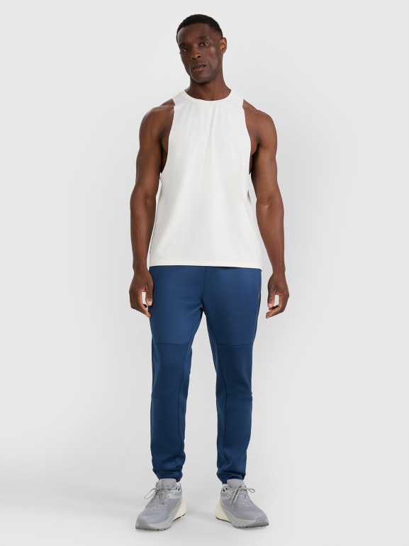 Męskie spodnie treningowe 4F 4FWAW25TFTRM0888 - granatowe