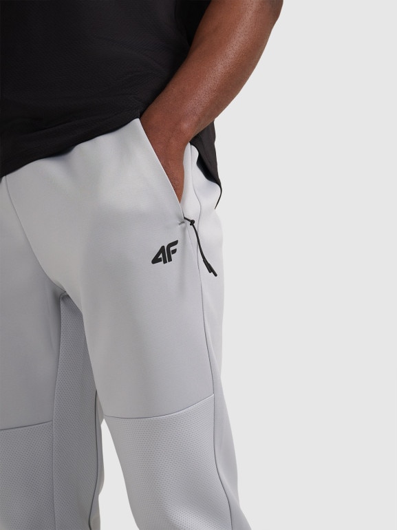 Męskie spodnie treningowe 4F 4FWAW25TFTRM0888 - szare