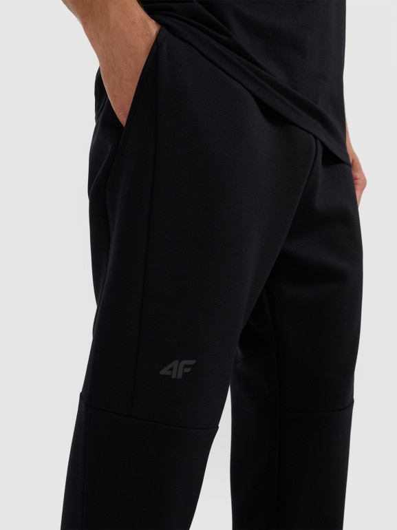 Męskie spodniei dresowe joggery 4F 4FWAW25TTROM1194 - czarne