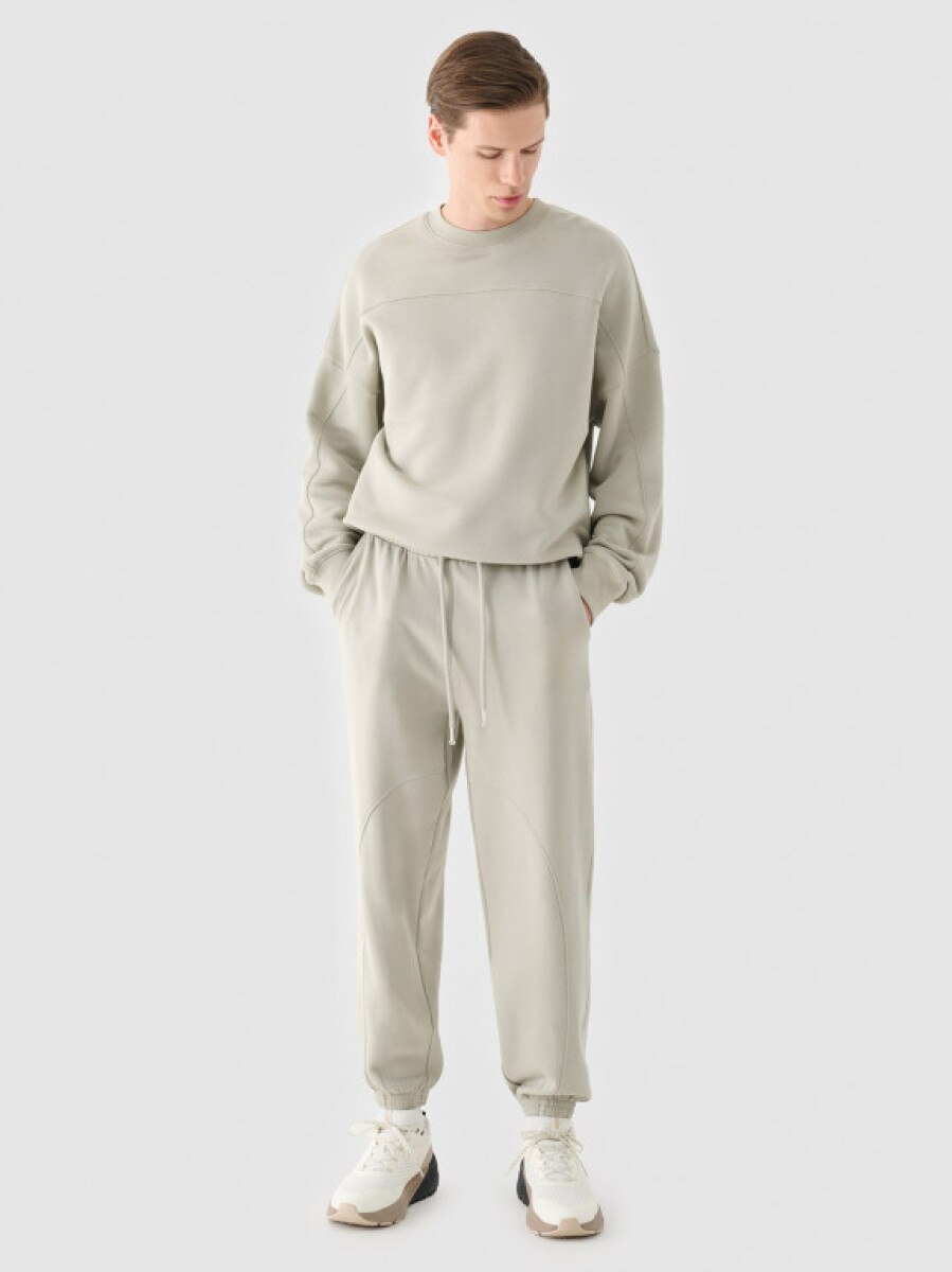 Męskie spodnie dresowe joggery Outhorn OTHWAW24TTROM1218 - szare