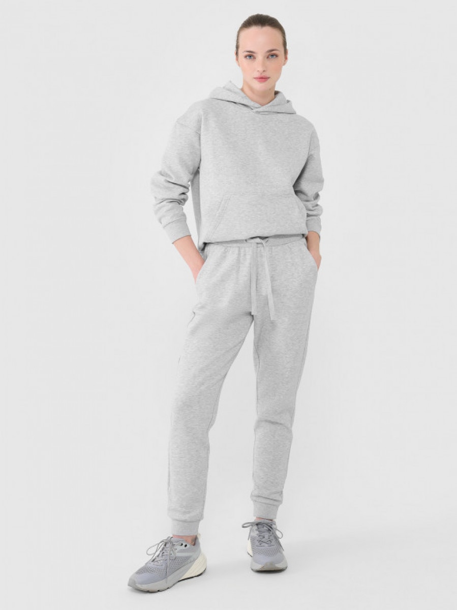 Damskie spodnie dresowe joggery Outhorn OTHWAW24TTROF1077 - szare