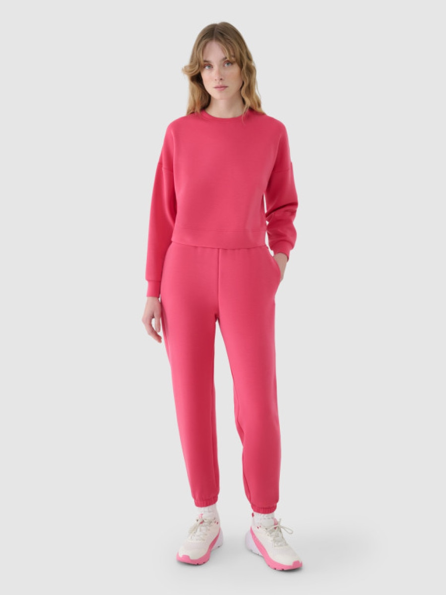 Damskie spodnie dresowe joggery 4F 4FWSS25TTROF1010 - różowe