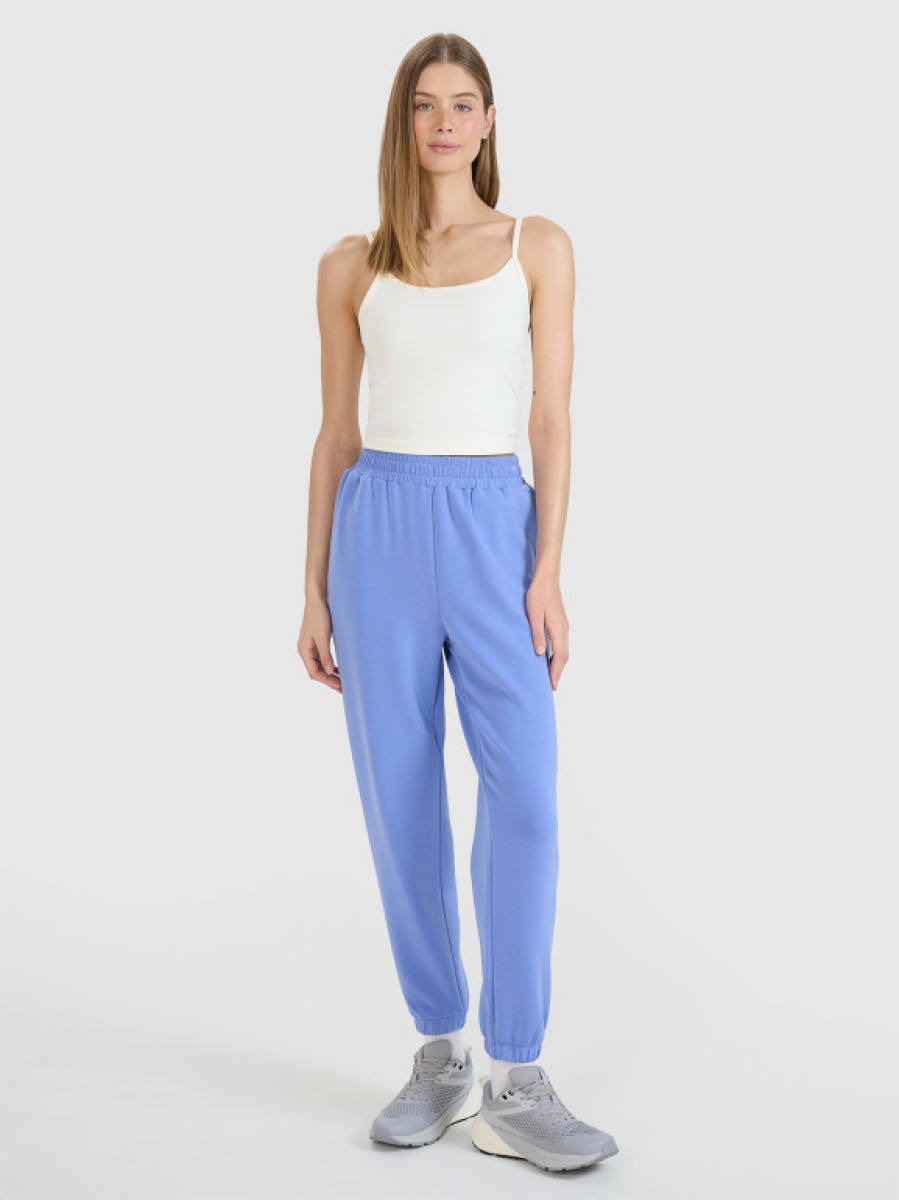 Damskie spodnie dresowe joggery 4F 4FWSS25TTROF1010 - niebieskie