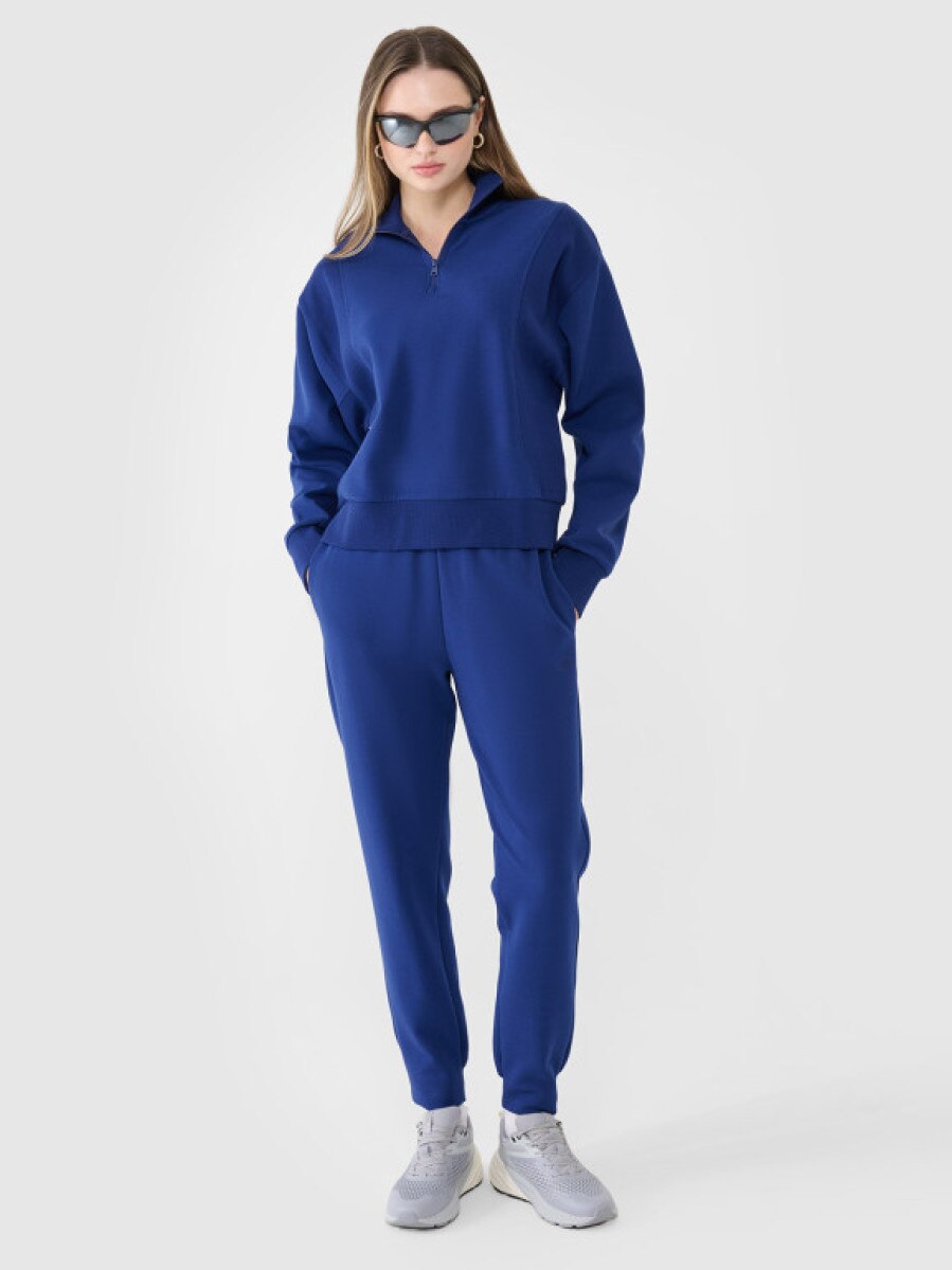 Damskie spodnie dresowe joggery 4F 4FWSS25TTROF0996 - granatowe