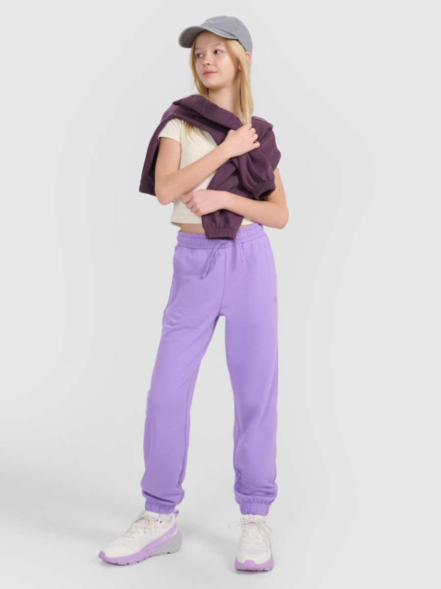 Dziewczęce spodnie dresowe joggery 4F 4FJWSS25TTROF1187 - fioletowe