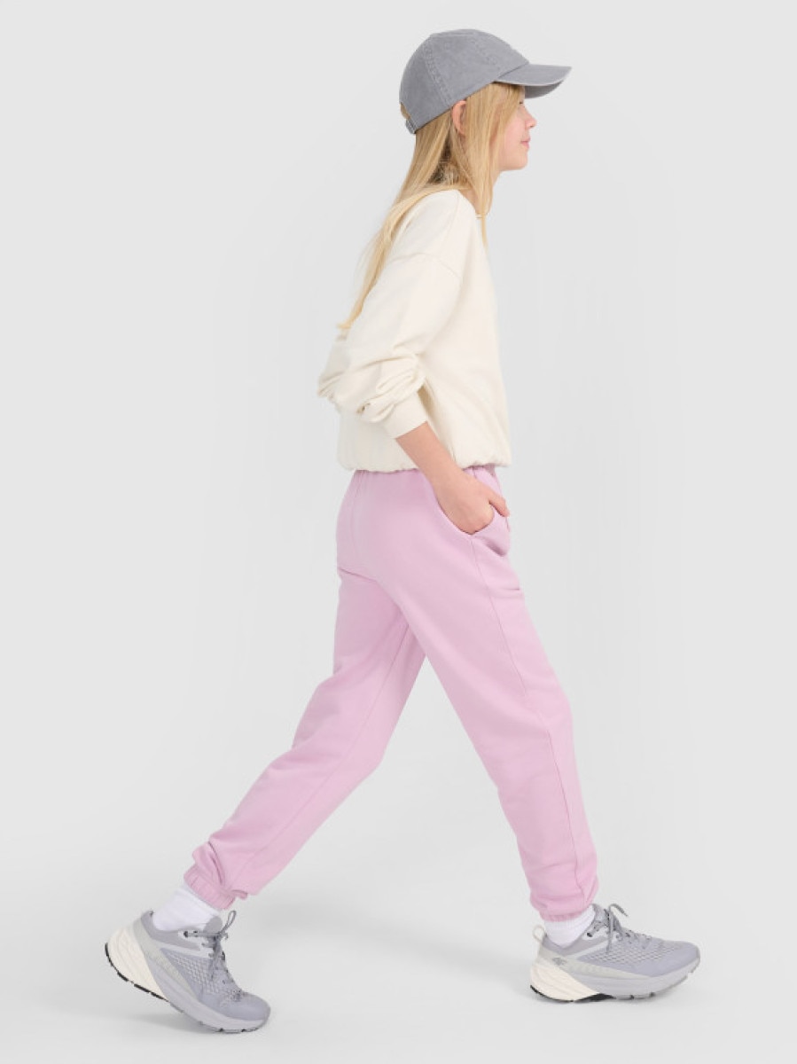 Dziewczęce spodnie dresowe joggery 4F 4FJWSS25TTROF1187 - różowe