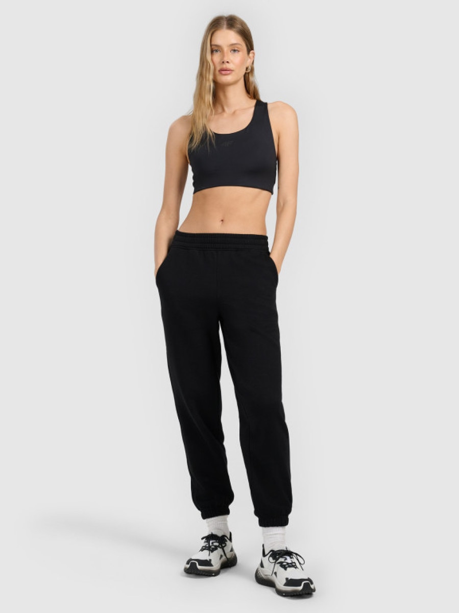 Damskie spodnie dresowe joggery 4F 4FRMM00TTROF1842 - czarne