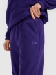 mini: Damskie spodnie dresowe joggery polarowe 4F 4FRAW25TTROF1707 - fioletowe (4)