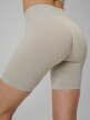 mini: Damskie legginsy kolarki treningowe 4F 4FWSS26TFSTF109 - beżowe (4)