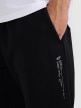 mini: Męskie spodnie dresowe joggery 4F 4FWAW25TTROM1211 - czarne (4)