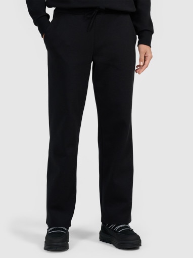 Damskie spodnie dresowe z szerokimi nogawkami 4F 4FRAW25TTROF1919 - czarne