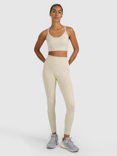 Damski biustonosz treningowy 4F 4FWAW25USBAF218 - beżowy