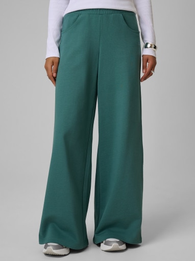 Damskie spodnie dresowe 4F 4FRSS26TTROF2011 - turkusowe