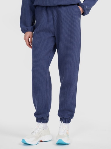 Damskie spodnie dresowe 4F 4FWAW25TTROF1184 - niebieskie