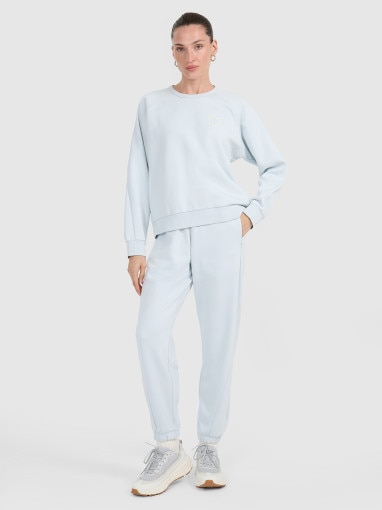  4F Damskie spodnie dresowe joggery 4F 4FWAW25TTROF1185  niebieskie Jasny niebieski