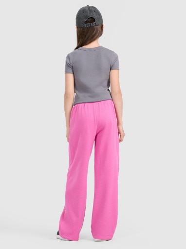 Dziewczęce spodnie dresowe 4F 4FJRAW25TTROF1601 - różowe