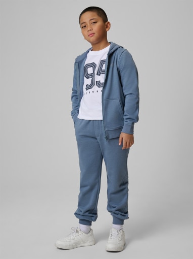  4F JUNIOR Chłopięce spodnie dresowe joggery 4F 4FJRSS26TTROM1824  denim Denim