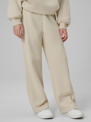 Dziewczęce spodnie dresowe 4F 4FJWSS26TTROF1656 - beżowe